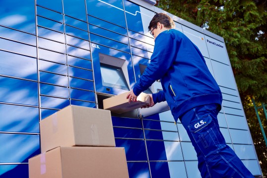 GLS-driver-delivering-parcels-into-a-parcel-locker